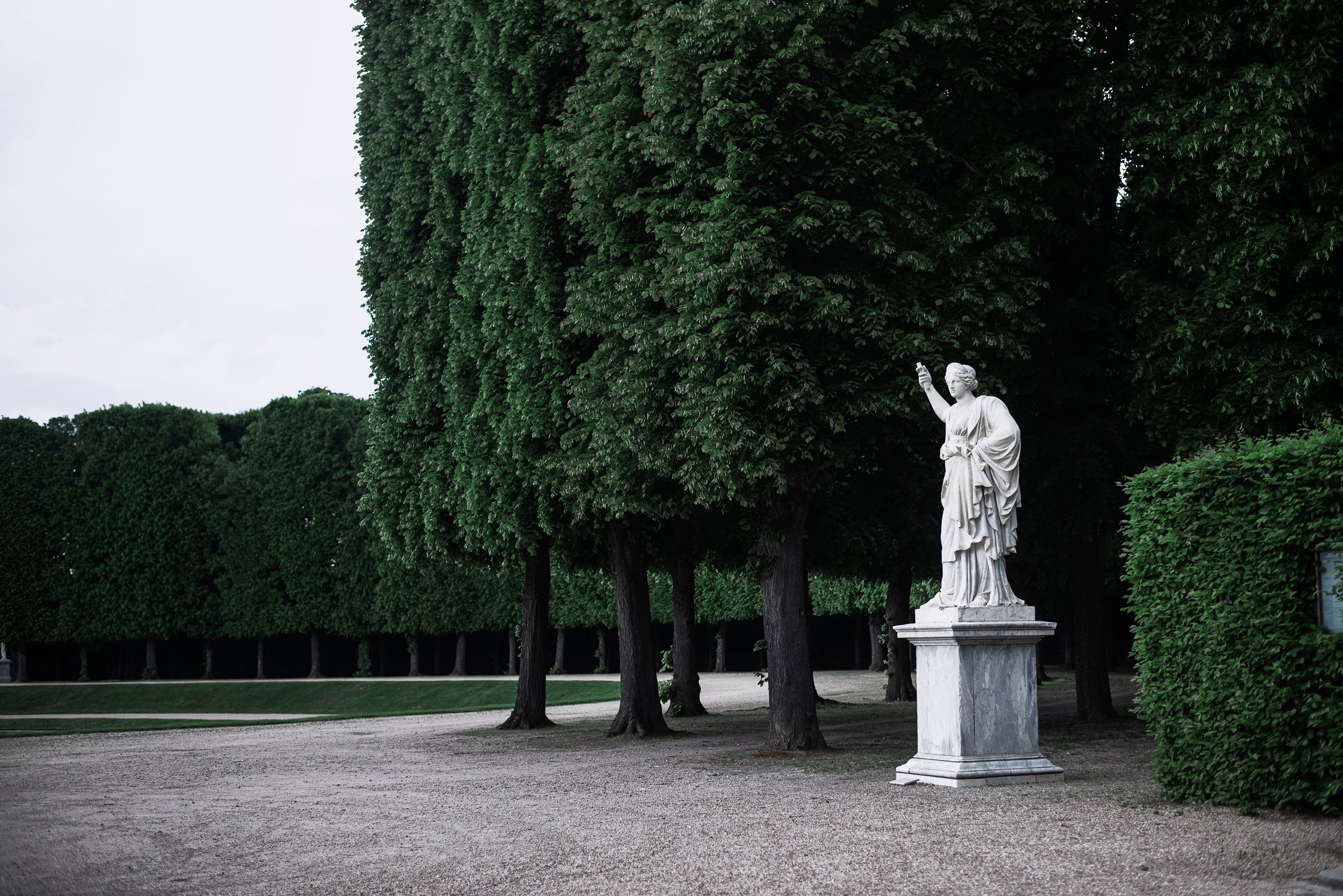 a-large-statue-sits-in-a-grove-of-trees.jpg